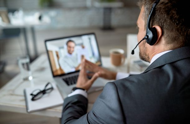 closeup entrepreneur using laptop while having online business meeting office scaled eec6e387